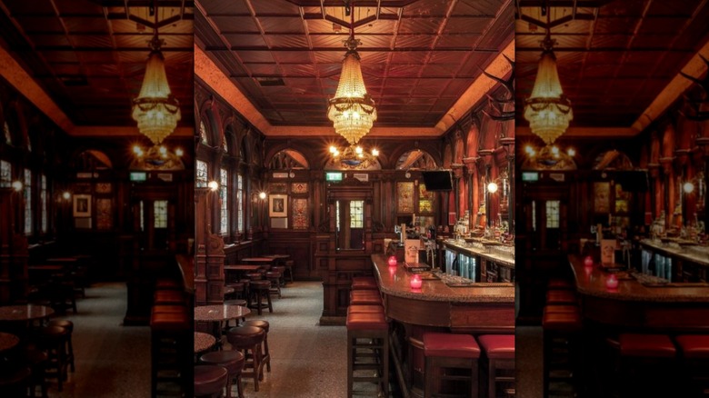 Bar with dim lighting and red stools at The Stag's Head