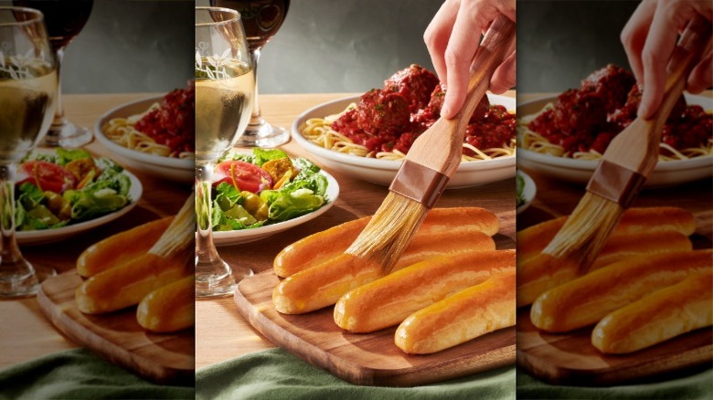 Olive Garden salad and breadsticks with spaghetti and meatballs
