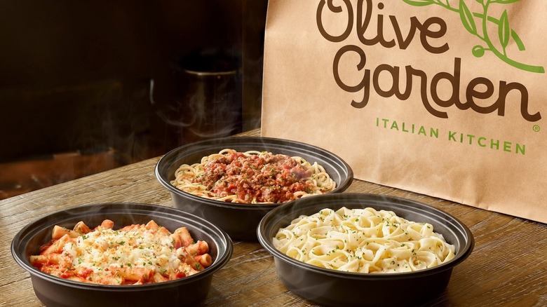 Olive Garden dishes in plastic containers with to-go bag