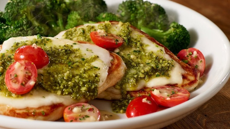 Plate of grilled chicken margherita and broccoli from Olive Garden