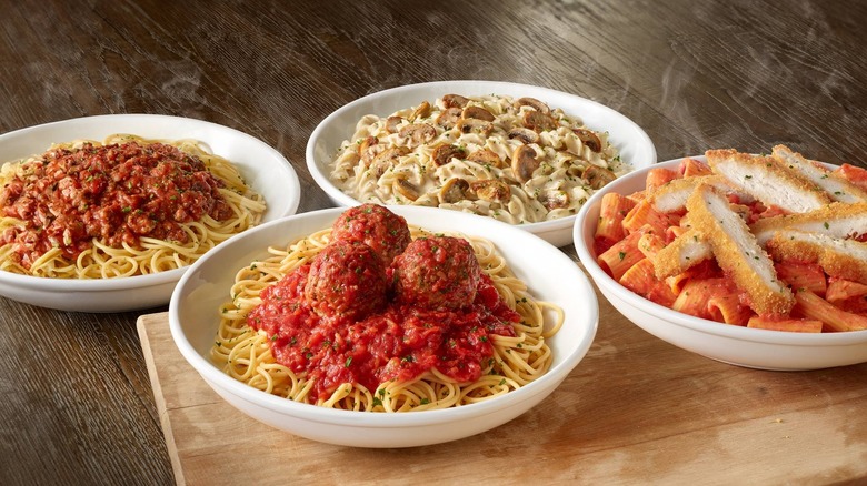 Four Olive Garden pasta dishes on table