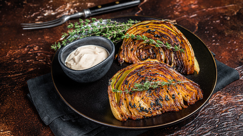 caramelized melting cabbage on black plate