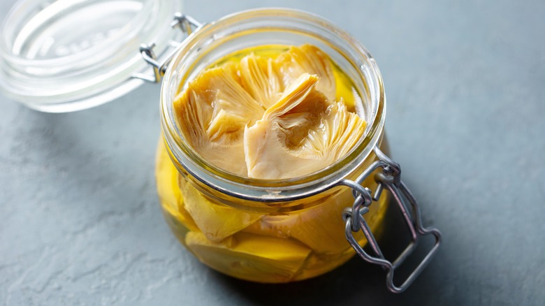 A jar of marinated artichokes
