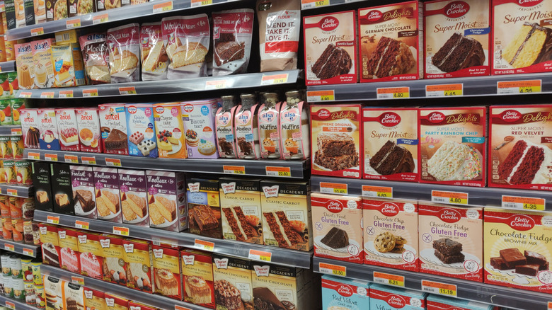 A supermarket shelf filled with Duncan Hines mixes