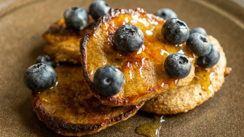 banana pancakes with blueberries and honey