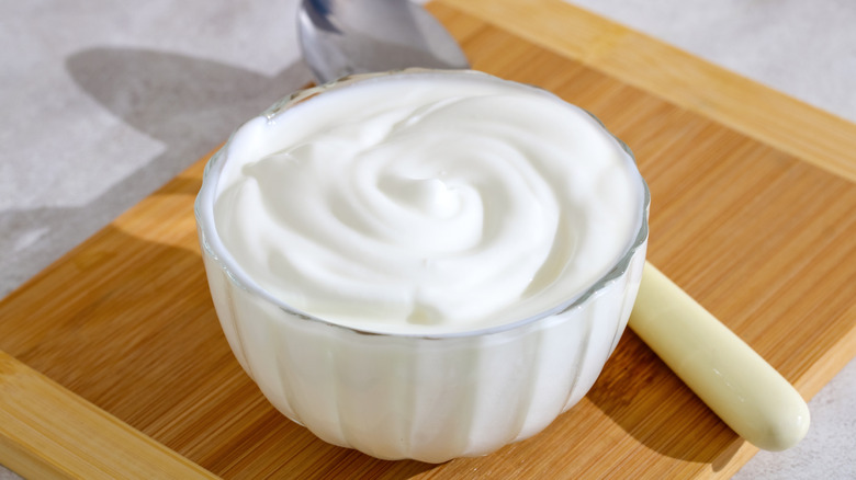 Greek yogurt in a small glass bowl.