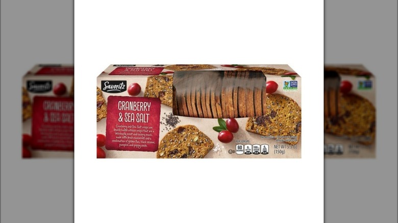 Box of Savoritz Cranberry Sea Salt Artisan Crisps crackers from Aldi on white background