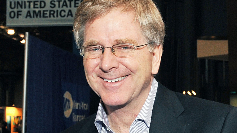 Rick Steves smiling in glasses