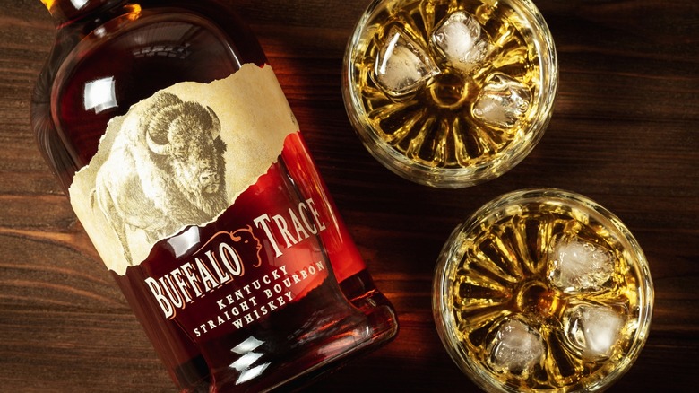 A bottle of Buffalo Trace Bourbon with two glasses