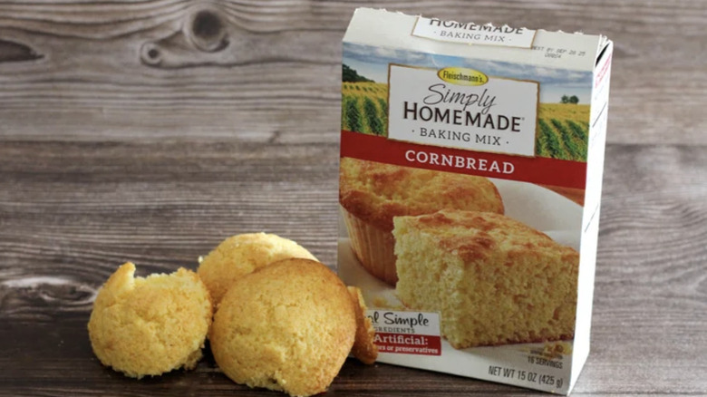 Closeup of a box of Fleischmann's corn bread mix and muffins on a table