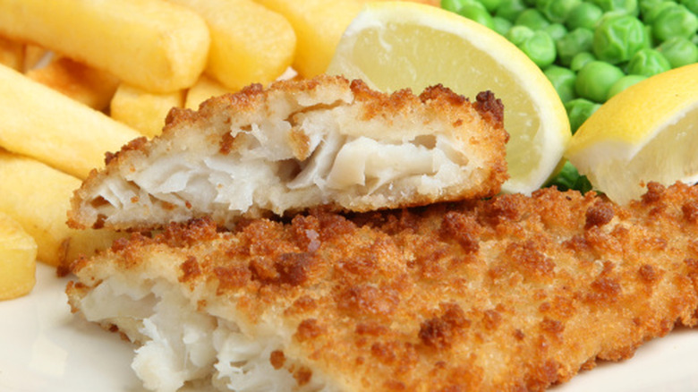 Breaded cod fillet, fries, and peas