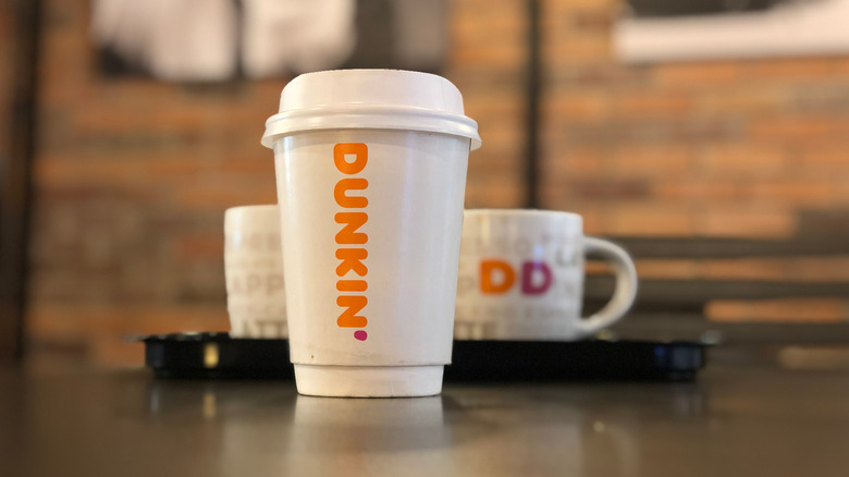 A Dunkin' Donuts coffee on countertop