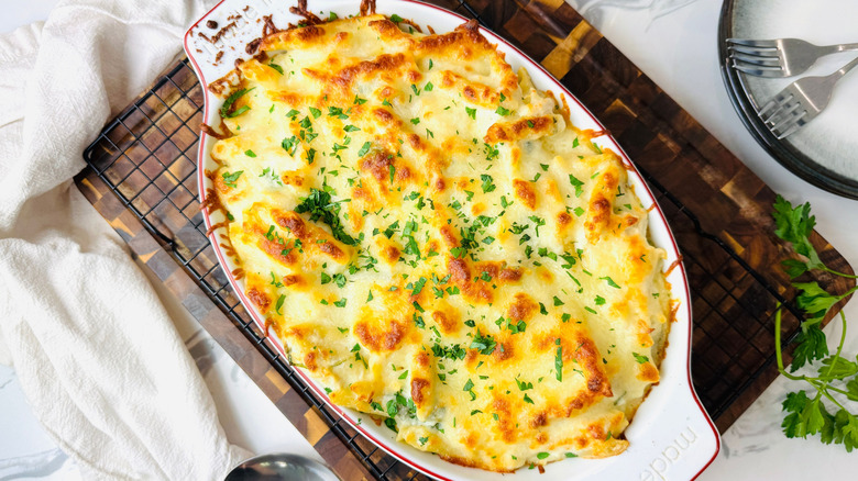Chicken Alfredo bake in oval baking dish