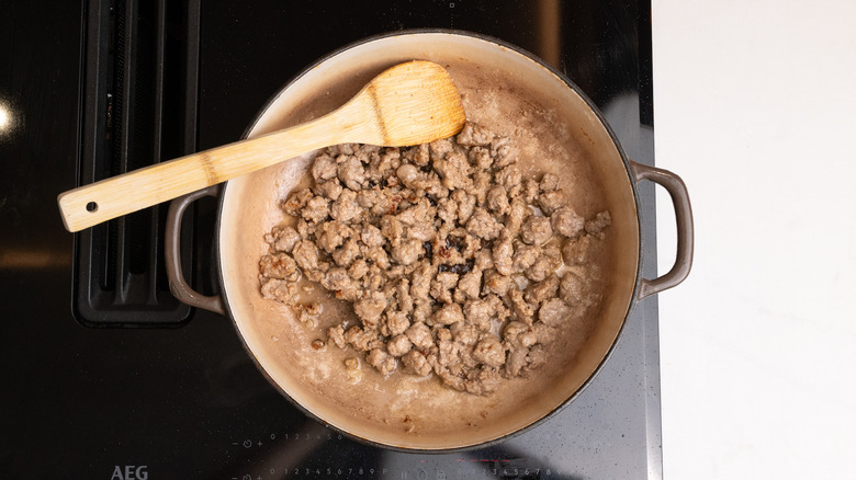 browning sausage in a pan