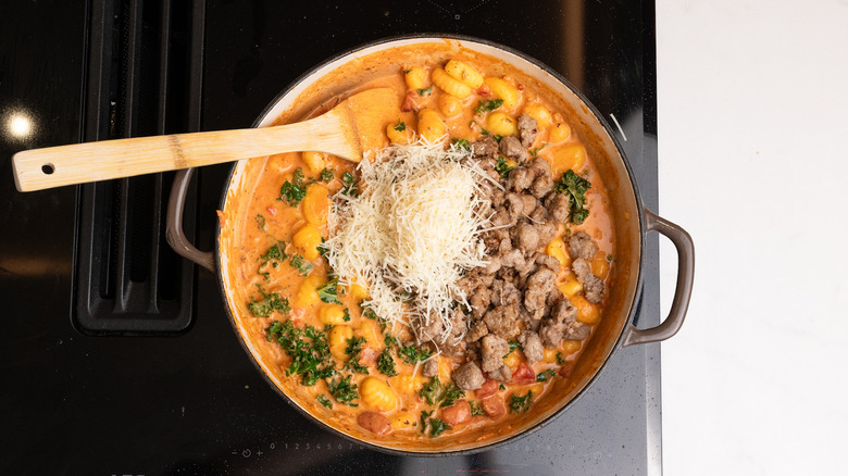 assembling sausage gnocchi dish