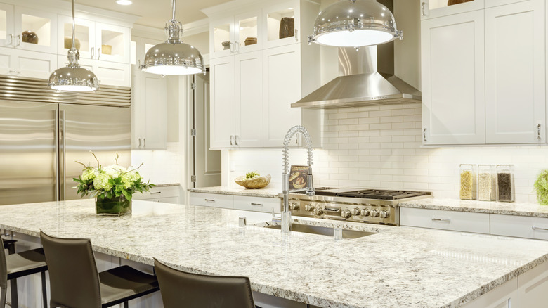 White kitchen with white granite island