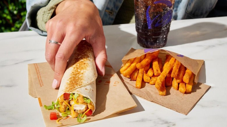 Taco Bell burrito with fries and drink