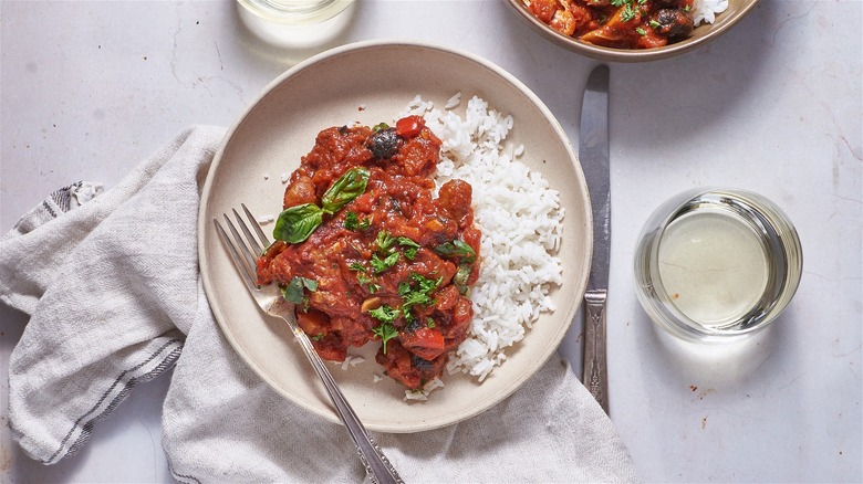 chicken cacciatore on plate with rice