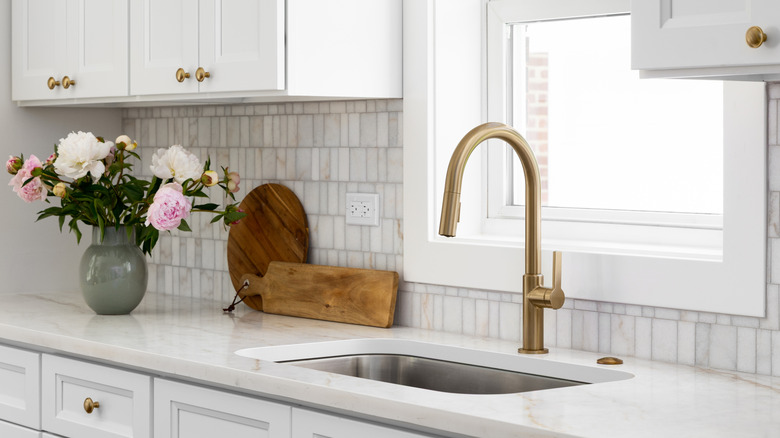 white kitchen with gold hardware