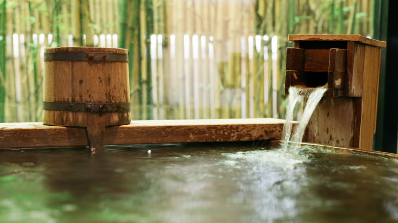 water pouring into onsen bath