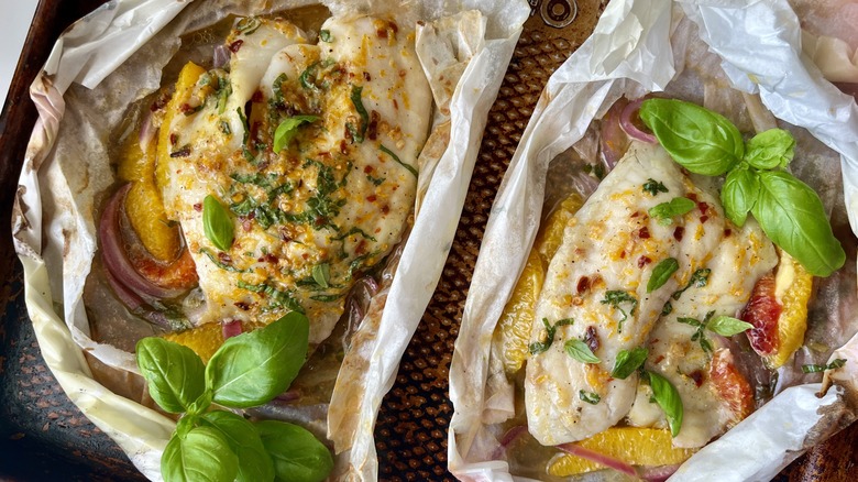 baked tilapia in parchment paper packets with herbs