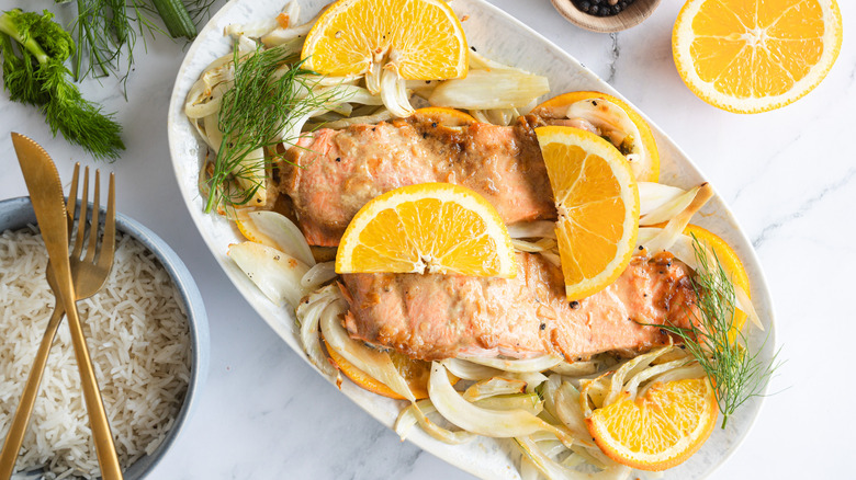 salmon with orange, fennel, and rice on platter