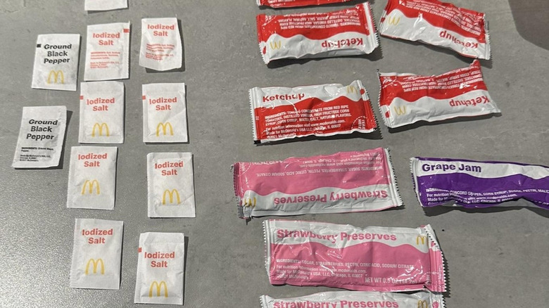 Packets of condiments on a counter top from McDonald's