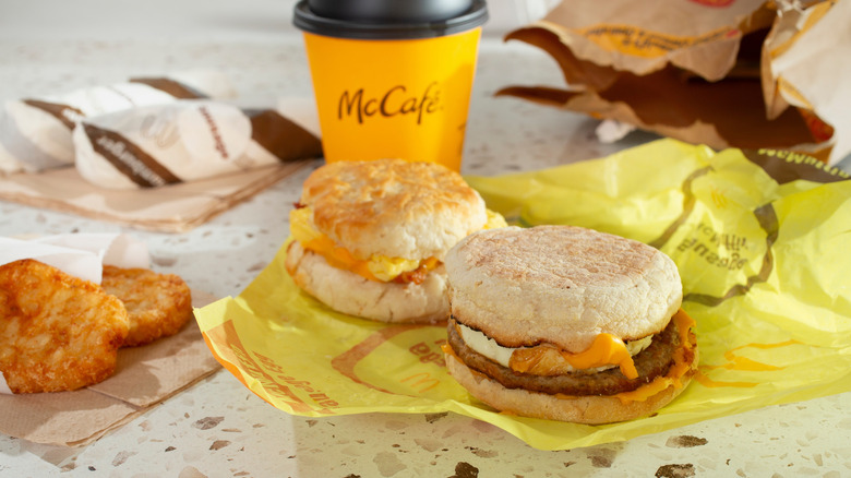 A McDonald's breakfast with sandwiches, hashbrowns, and coffee