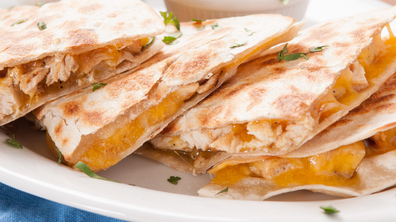 chicken quesadilla cut and stacked on white plate