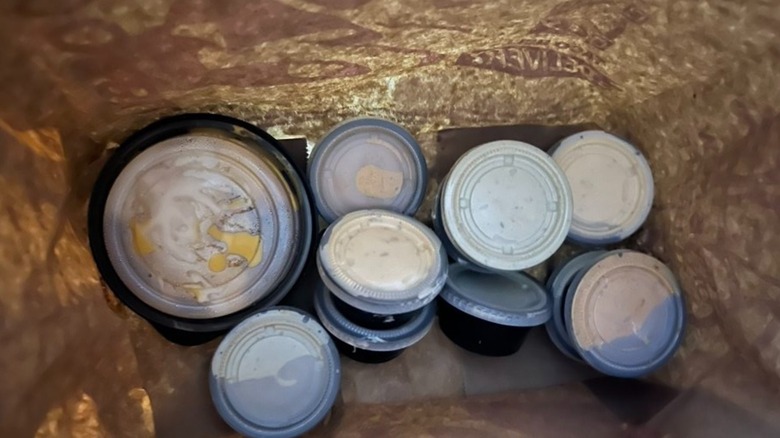 Taco Bell sauces shown inside paper bag