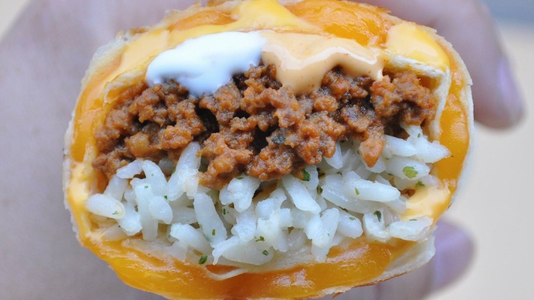 saucy Quesarito close up shot oozing cheese