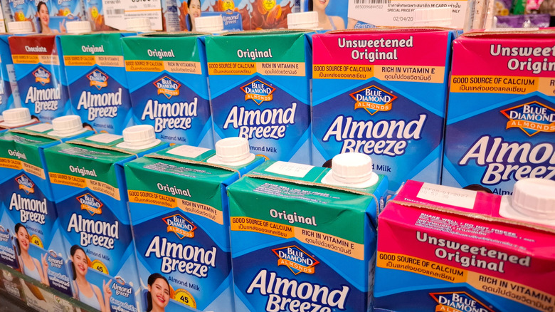 Cartons of Almond Breeze stacked on shelves