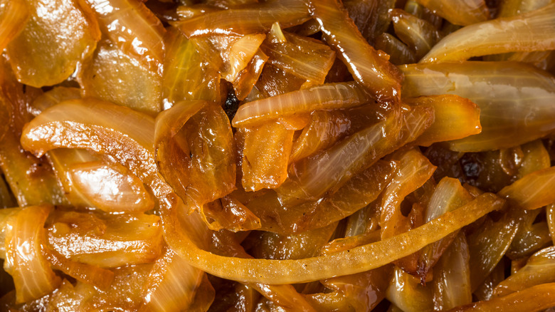 A closeup of a pile of caramelized onions
