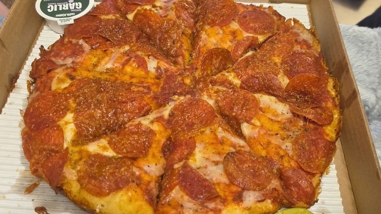 A well done baked pizza from Papa Johns