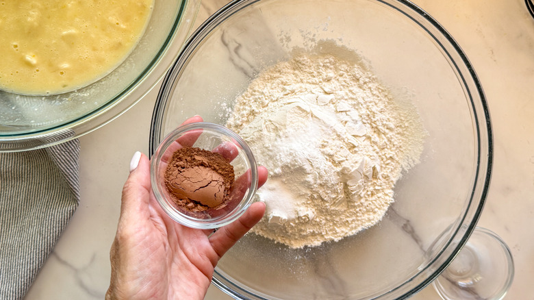 bowl of cocoa powder over bowl of flour