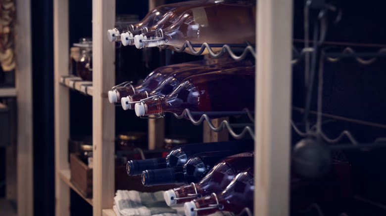 Bottles stacked on an Ikea Ivar bottle rack