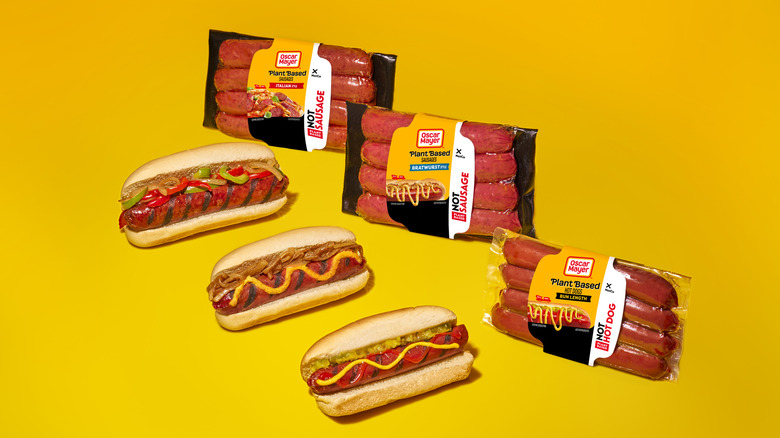 Plant-based Oscar Mayer sausages and hot dogs on a yellow background
