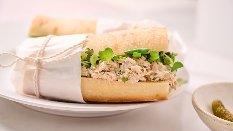 Tuna salad sandwich wrapped with parchment and twine