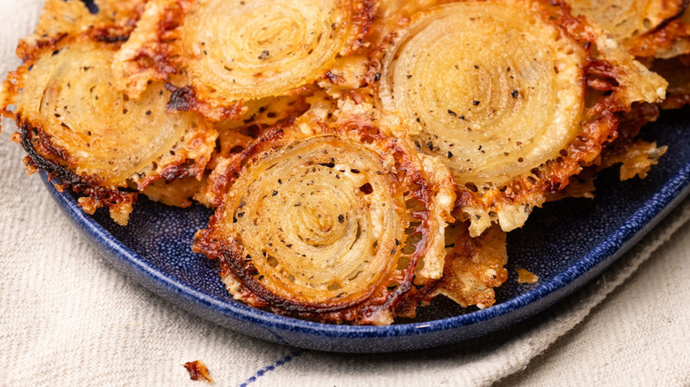 Crispy onion ring chips on plate