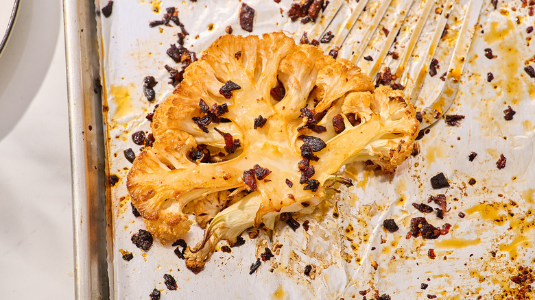 roasted chili crisp cauliflower on a baking sheet