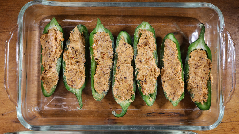 baking dish of cream cheese-stuffed jalapeño halves