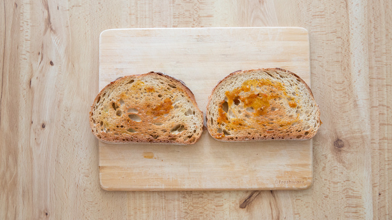 Toasted bread on wooden board