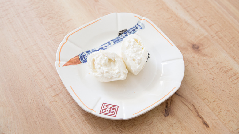sliced ball of burrata cheese