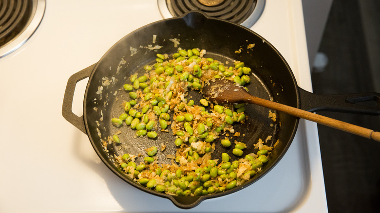 edamame sautee cooking in pan