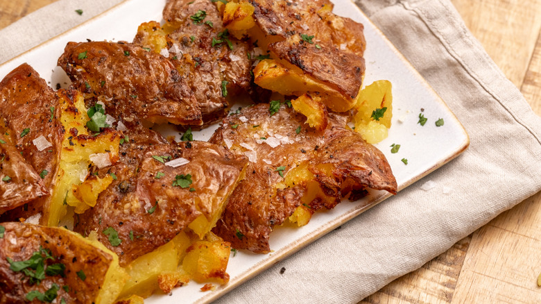 Garlic smashed potatoes on serving plate