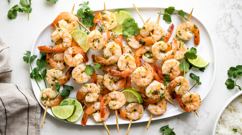 Shrimp skewers on serving plate