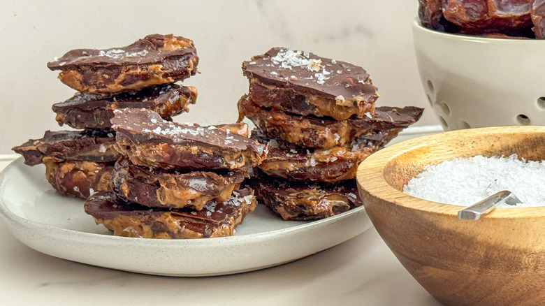 Date bark pieces stacked on plate