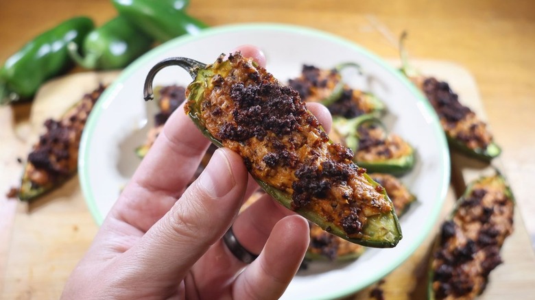 Hand holding jalapeño popper