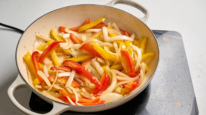 cooking onion and pepper in a skillet