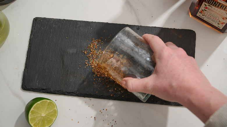 rimming a rocks glass with tajin